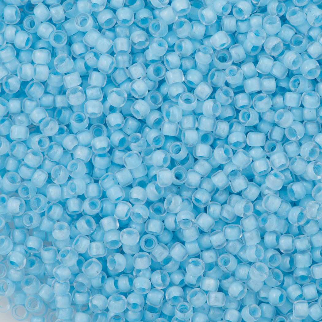 50g Toho Round Seed Bead 8/0 Inside Color Crystal Neon Ice Blue Lined (976)