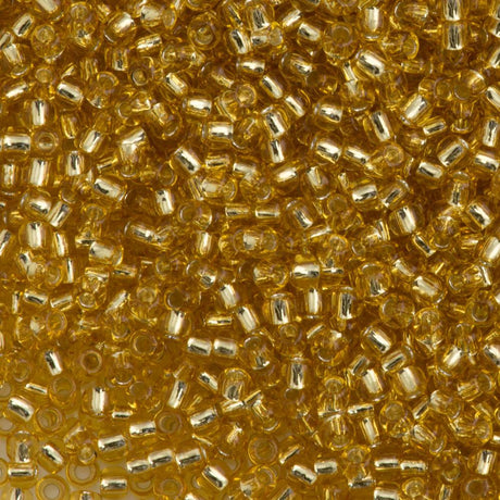 50g Toho Round Seed Bead 11/0 Permanent Finish Silver Lined Gold (22PF)