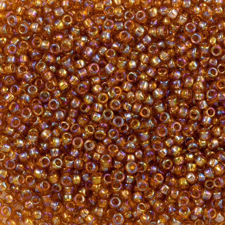 Toho Round Seed Bead 15/0 Transparent Dark Amber AB (162C)